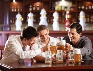 Guys enjoying a beer