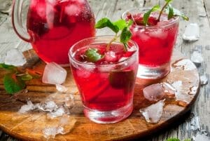Hibiscus summer punch in glasses and in a pitcher